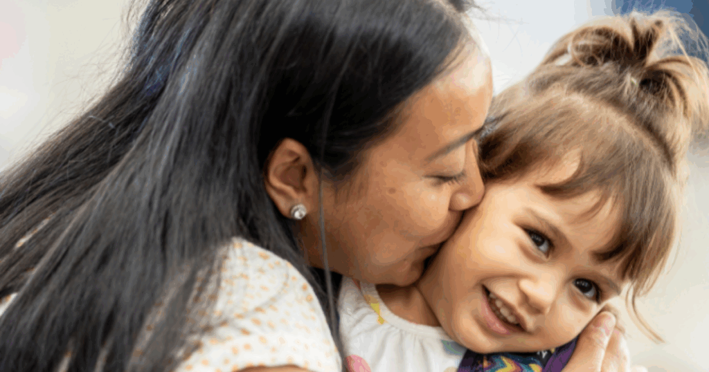 Mother hugging child at Grateful Hearts Preschool, a preschool with daily communication app in Las Vegas that keeps parents connected
