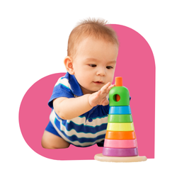 baby stacking colorful rings on wooden toy
