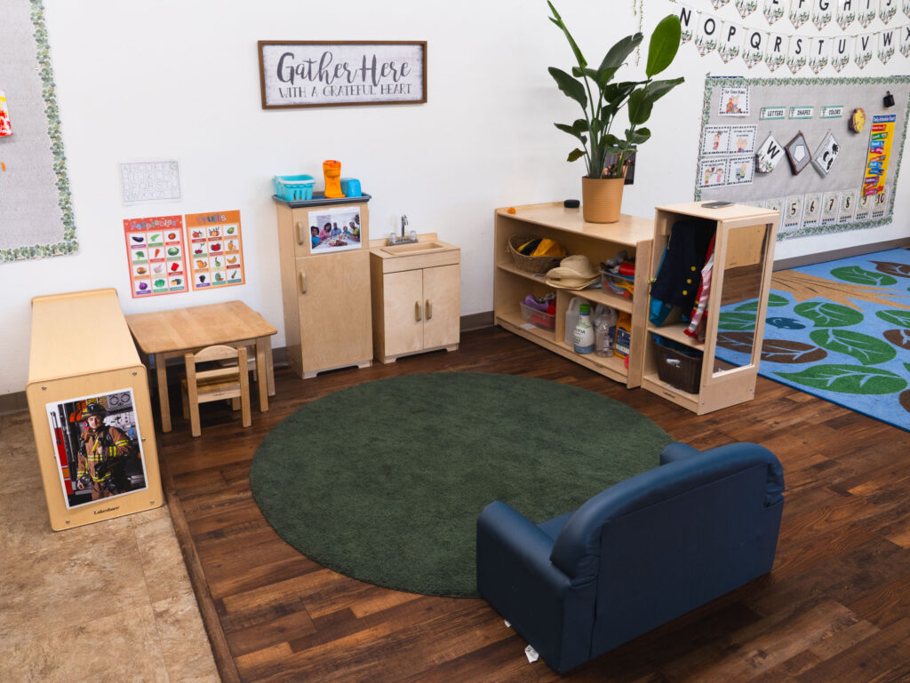 Early Preschool classroom with colorful learning areas and play spaces