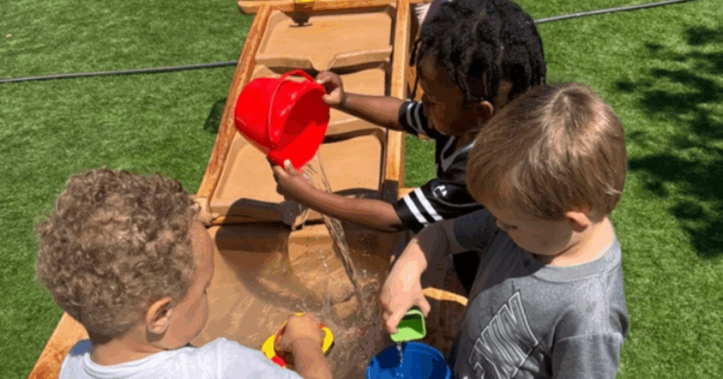 Children at Grateful Hearts Preschool participate in outdoor water play activities that support social development and early learning in Las Vegas.