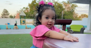 Happy toddler enjoying outdoor play at an affordable preschool in Henderson with a safe early childhood learning environment